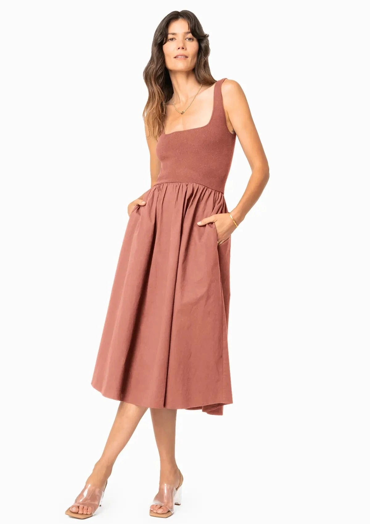 A single green leaf against a white background.