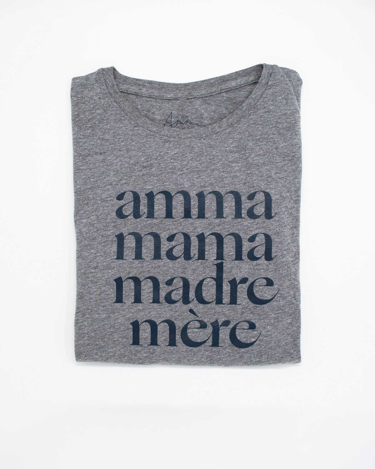 Folded heather grey tee shirt that reads Amma, Mama, Madre, Mere on a white background