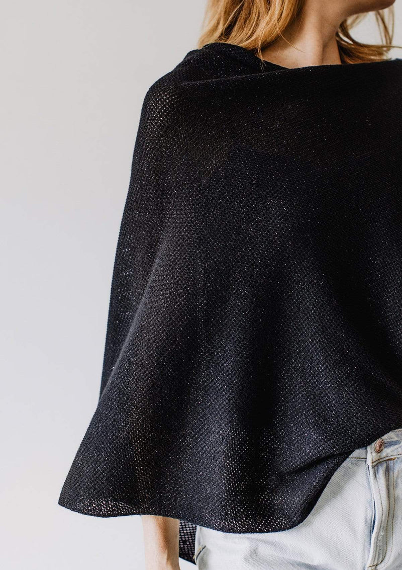 Closeup of sparkly black knit nursing cover on Emily Baldoni