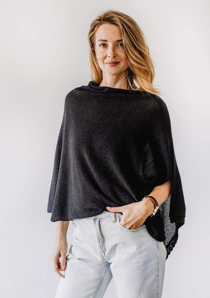 Emily Baldoni wearing sparkly black knit nursing cover styled as cape