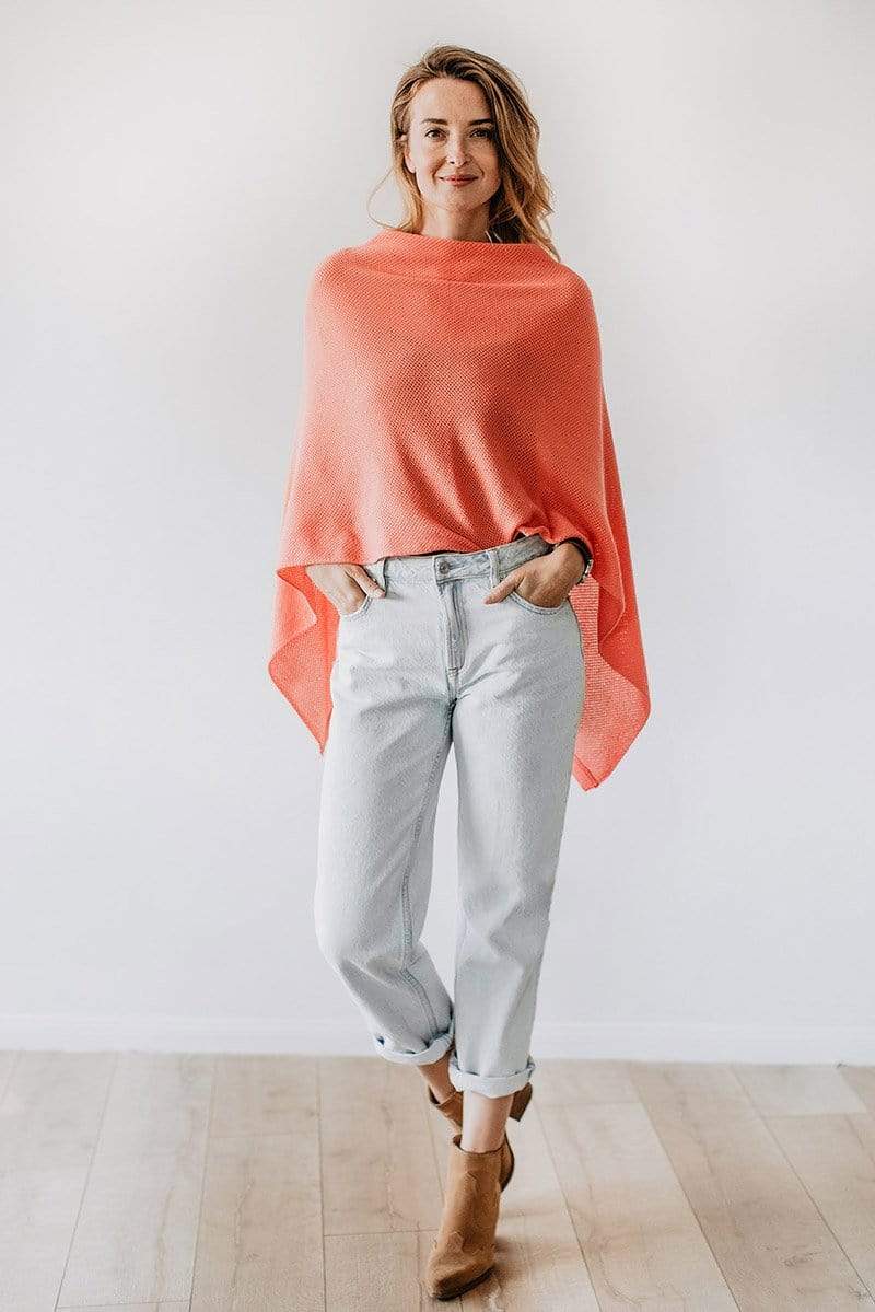 Emily Baldoni wearing coral knit Cocoon nursing cover styled as cape