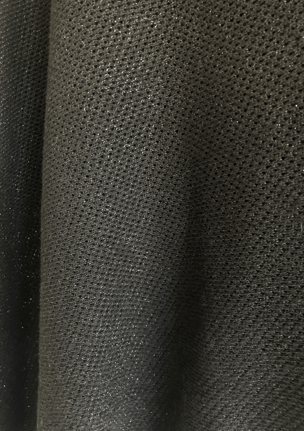 Closeup of sparkly black knit breathable nursing cover 